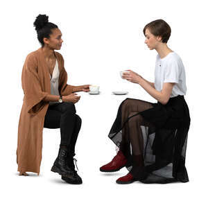 two cut out women sitting in a cafe