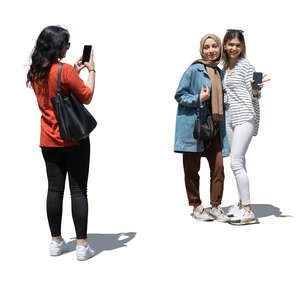 cut out teenage girl taking a picture of her two friends