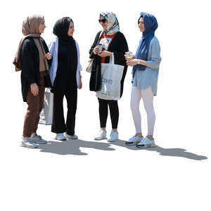 cut out backlit group of teenage muslim girls standing