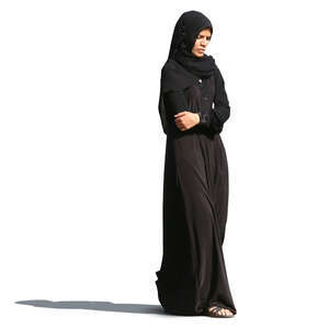 muslim woman in a black abaya walking