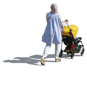 muslim woman with a baby stroller walking