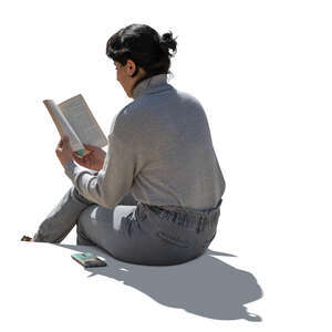 cut out backlit woman sitting and reading a book