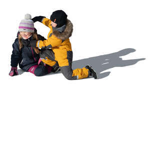 two cut out kids in winter playing outside