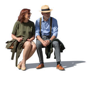 cut out older man and woman sitting outside