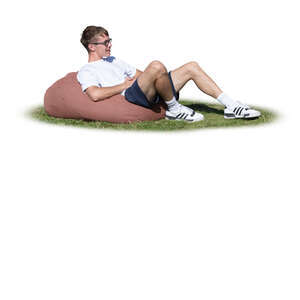 cut out young man sitting outside on a bean bag chair