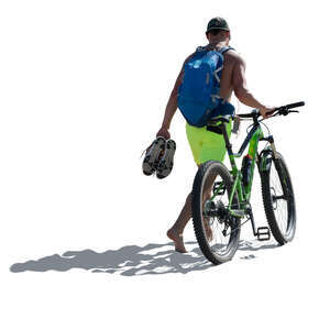 cut out man with a a bike walking on the seaside barefoot