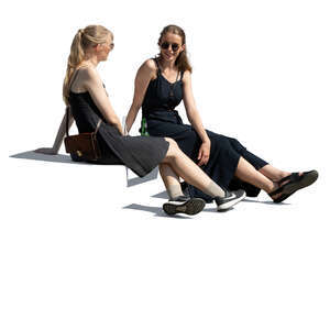 two cut out young women sitting casually and talking