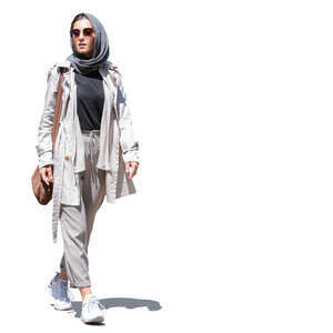 cut out young modern muslim woman walking