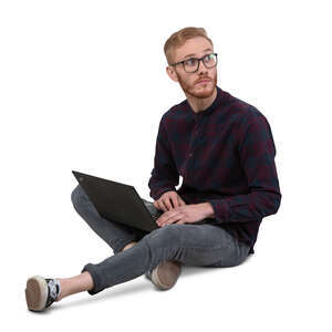 cut out man with a laptop sitting on the floor