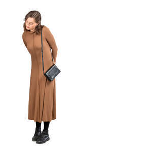 cut out woman in a brown dress standing and looking at smth