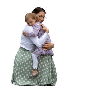 woman squatting and hugging her daughter