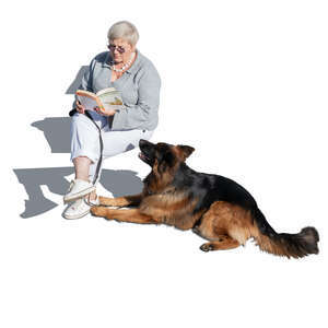 older woman with a german shepard dog sitting and reading seen from above