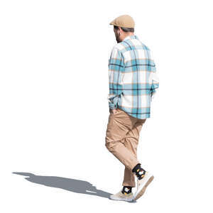 man with a checkered shirt and a hat walking