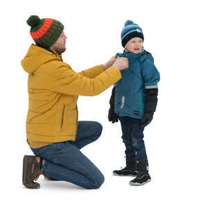 father adjusting his sons scarf in winter