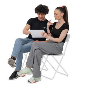 cut out man and woman sitting and discussing thing over tablet