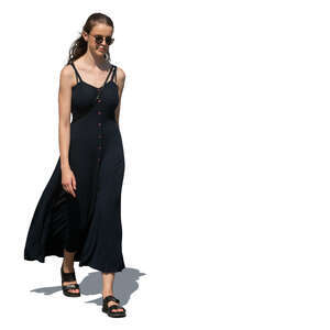 cut out woman in a long black summer dress walking