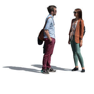 two people standing outside and talking