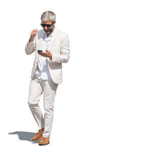 cut out man in a white suit walking