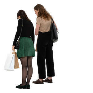 two women standing in a shop and looking down on a counter