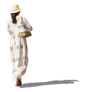 woman with a hat and waring a summer dres walking