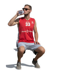 cut out sportsman sitting and drinking water