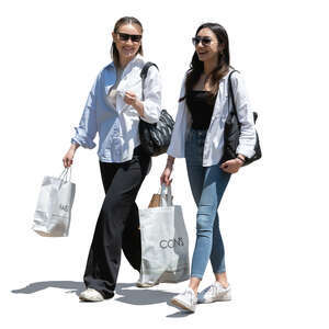 two happy women with shopping bags walking