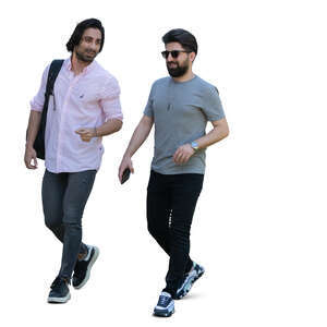 two dark haired men walking and talking