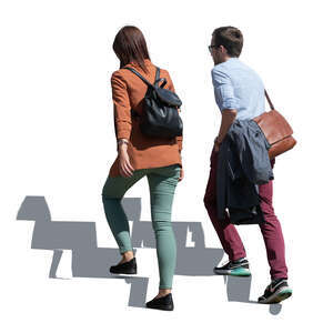 man and woman walking up the stairs outdoors