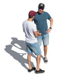 two men with baseball caps standing and talking