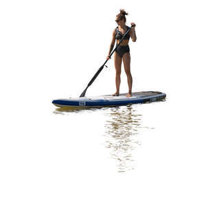 cut out backlit woman paddleboarding