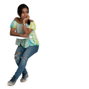 indian woman sitting and leaning elbows on a table