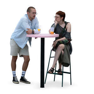 man and woman sitting at a bar table and drinking