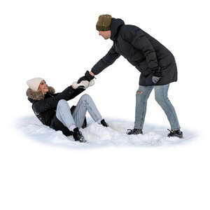 man pulling up a woman sitting in the snow