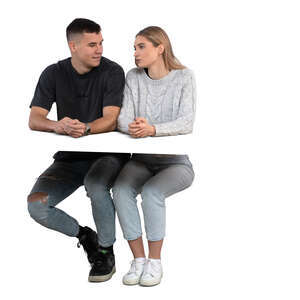 man and woman sitting behind a desk