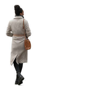 woman wearing an overcoat walking