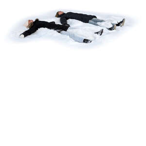 two cut out people lying in the snow making snow angels