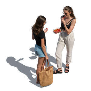 two women standing and eating strawberries seen from above