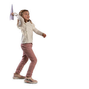 little girl throwing a paper plane