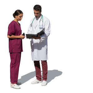 two medical workers standing outside and talking