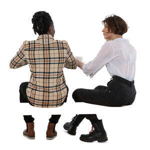 two people sitting behind a table seen from back angle