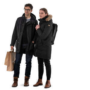 man and woman standing in winter and looking at shop windows