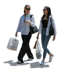 two backlit women coming from shopping