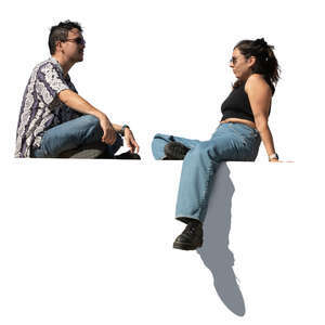 two cut out people sitting seen from below angle