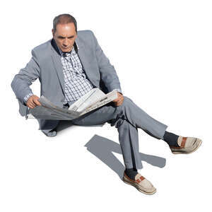 cut out older gentleman sitting and reading a newspaper seen from above