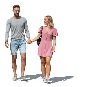 couple holding hands and walking in summer