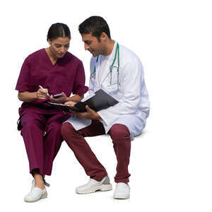 two medical workers sitting and talking