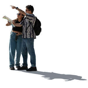 backlit man and woman with a tourist map standing and discussing