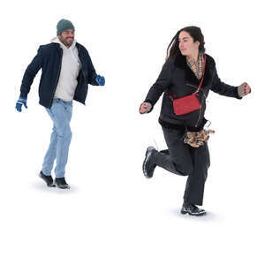 man and woman running in the snow