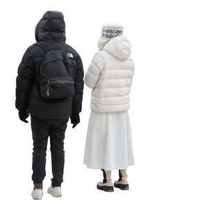 man and woman dressed in black and white winter jackets standing