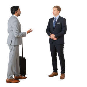 cut out businessman talking to a hotel receptionist